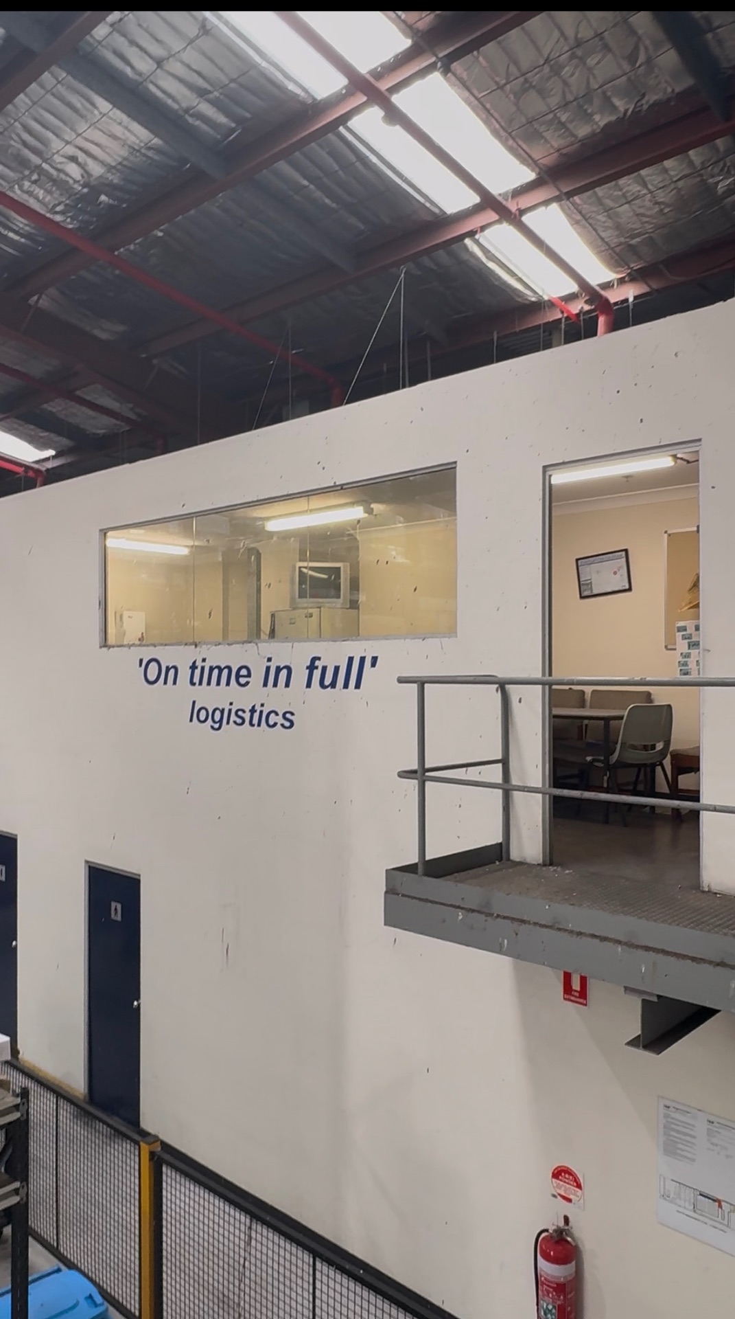 Mezzanine office with viewing glass above the workshop floor
